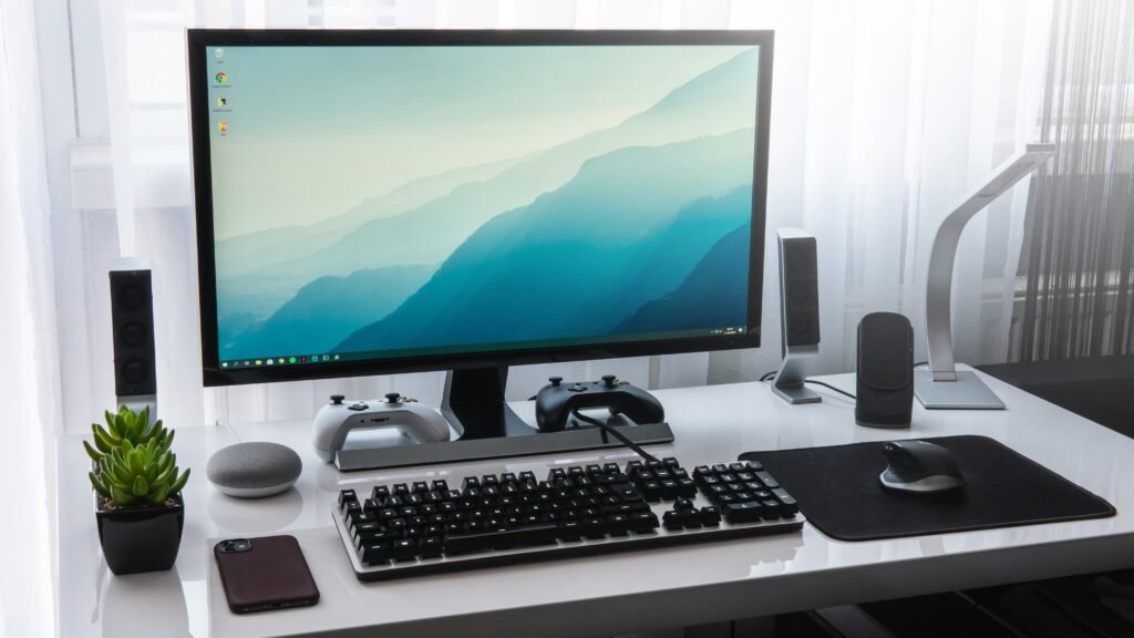 Home Office Setup A home office setup with the monitor at eye level, keyboard and an angled desk lamp